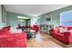 Inviting living room area with hardwood floors, comfortable seating, and natural light at 5115 Estonian Dr, Fairburn, GA 30213