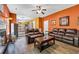 Comfortable living room with hardwood floors and an open design leading to the kitchen and dining area at 5115 Estonian Dr, Fairburn, GA 30213