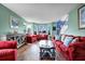 Spacious living room with hardwood flooring, ample seating, and lots of natural light at 5115 Estonian Dr, Fairburn, GA 30213