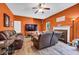 Spacious living room featuring hardwood floors, dark-colored walls, and comfortable seating at 5115 Estonian Dr, Fairburn, GA 30213