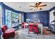 Well-lit home office with a desk setup, ample shelving, and an exercise machine at 5115 Estonian Dr, Fairburn, GA 30213