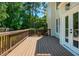Beautiful back deck with wood railings and french door access to the home's interior at 1096 Bridge Mill Ave, Canton, GA 30114