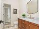 Bathroom featuring a wood vanity with marble countertop, modern fixtures, and stylish tile at 1096 Bridge Mill Ave, Canton, GA 30114