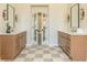 Dual vanities with stone countertops and french doors that lead to another room at 1096 Bridge Mill Ave, Canton, GA 30114