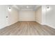 Spacious bedroom with a tray ceiling, recessed lights, and sleek hardwood floors at 1096 Bridge Mill Ave, Canton, GA 30114
