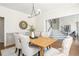 Spacious dining room with a light wood table, upholstered chairs, and views to the staircase at 1096 Bridge Mill Ave, Canton, GA 30114