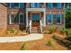 Close-up of the entrance with a brick facade, a double front door, and manicured landscaping at 1096 Bridge Mill Ave, Canton, GA 30114