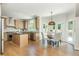 Spacious kitchen with a center island, stainless steel appliances, and an adjacent breakfast nook at 1096 Bridge Mill Ave, Canton, GA 30114