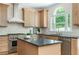 Modern kitchen with stainless steel appliances, granite countertops, and ample cabinet space at 1096 Bridge Mill Ave, Canton, GA 30114