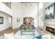 Bright living room featuring high ceilings, a fireplace, and an open floor plan leading to the kitchen at 1096 Bridge Mill Ave, Canton, GA 30114
