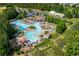 Aerial view of a community pool and recreational center surrounded by trees and lush landscaping at 1096 Bridge Mill Ave, Canton, GA 30114