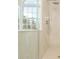 Modern tiled shower with rainfall shower head and handheld sprayer at 1096 Bridge Mill Ave, Canton, GA 30114