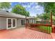 Charming backyard showcasing a beautiful deck and patio with verdant lawn for outdoor living and entertaining at 215 Truehedge Trce, Roswell, GA 30076
