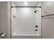 Modern bathroom showcasing subway tiles, matte black fixtures, and a shower-tub combination at 215 Truehedge Trce, Roswell, GA 30076