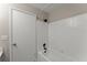 Clean bathroom features a tub with tile surround, providing a functional space at 215 Truehedge Trce, Roswell, GA 30076