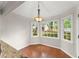 Cozy breakfast nook featuring hardwood floors, bright windows, and a modern chandelier at 215 Truehedge Trce, Roswell, GA 30076