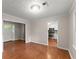 Inviting dining room with hardwood floors, natural light, and an open doorway to the kitchen at 215 Truehedge Trce, Roswell, GA 30076