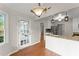Well-lit kitchen features granite counters, white cabinets, and stainless steel appliances at 215 Truehedge Trce, Roswell, GA 30076