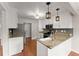 Well-equipped kitchen with stainless appliances, granite countertops, and ample cabinet space at 215 Truehedge Trce, Roswell, GA 30076