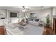 Bright living room boasts built-in shelving, a fireplace, and large windows that offer an airy ambiance at 215 Truehedge Trce, Roswell, GA 30076