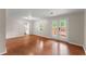 Spacious living room features hardwood floors and French doors, perfect for entertaining at 215 Truehedge Trce, Roswell, GA 30076