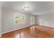 Sun-filled living room with backyard access and hardwood floors offers a relaxing space at 215 Truehedge Trce, Roswell, GA 30076