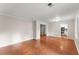 Spacious living room with hardwood floors and neutral paint, ready for your personal touch at 215 Truehedge Trce, Roswell, GA 30076