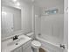 This bathroom features a tub/shower combination and updated vanity at 4425 Amy Rd, Snellville, GA 30039