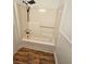 Bathroom features a tub with updated shower head and fixtures at 6002 Pat Mell Se Pl, Smyrna, GA 30080