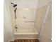 Updated bath features a tub with shower head at 6002 Pat Mell Se Pl, Smyrna, GA 30080