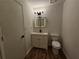 Well-lit bathroom with modern vanity, LED mirror and stylish fixtures at 6002 Pat Mell Se Pl, Smyrna, GA 30080