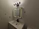 Modern bathroom with vanity, sink, and LED mirror at 6002 Pat Mell Se Pl, Smyrna, GA 30080
