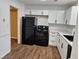 Modern kitchen featuring new appliances, ample counter space, and durable floors at 6002 Pat Mell Se Pl, Smyrna, GA 30080