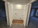 Laundry closet with washer hookups and shelving, providing convenient laundry solutions at 6002 Pat Mell Se Pl, Smyrna, GA 30080