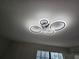 Modern light fixture with a contemporary design, enhancing the room's ambiance at 6002 Pat Mell Se Pl, Smyrna, GA 30080