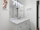 Well-lit bathroom with a modern vanity, bright lighting, and neutral tones creating a clean and welcoming space at 607 Riverview Se Dr # 607, Marietta, GA 30067