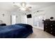 Inviting bedroom with large French doors and a TV mounted on the wall to create a calming retreat at 607 Riverview Se Dr # 607, Marietta, GA 30067