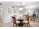 Dining room with glass table and views into the living room with a fireplace at 607 Riverview Se Dr # 607, Marietta, GA 30067