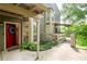 Exterior entrance highlighting the covered entryway, walkway, and partial view of the yard at 607 Riverview Se Dr # 607, Marietta, GA 30067