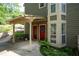 Exterior entrance showcasing the covered entryway, brick facade and beautiful plants at 607 Riverview Se Dr # 607, Marietta, GA 30067