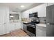 Modern kitchen featuring stainless steel appliances and white cabinetry at 607 Riverview Se Dr # 607, Marietta, GA 30067