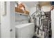 Functional laundry room equipped with washer, dryer and shelving at 607 Riverview Se Dr # 607, Marietta, GA 30067