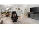 Open living room featuring a dining area and a view into the bright kitchen at 607 Riverview Se Dr # 607, Marietta, GA 30067