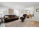 Bright living room with comfortable seating, an ornate mirror and a view of the dining area at 607 Riverview Se Dr # 607, Marietta, GA 30067