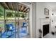 Cozy screened patio featuring outdoor seating, wood ceilings, and a view of the fireplace for relaxation at 607 Riverview Se Dr # 607, Marietta, GA 30067