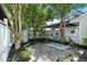 Cozy backyard patio with a seating area surrounded by lush greenery at 663 Serramonte Dr, Marietta, GA 30068