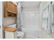Bathroom features a tub and shower combination, updated fixtures, and a wood cabinet at 663 Serramonte Dr, Marietta, GA 30068