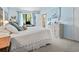 Comfortable bedroom featuring a queen bed, light blue walls, and carpeted flooring at 663 Serramonte Dr, Marietta, GA 30068