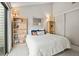 Aesthetic bedroom with built-in shelves and a sliding glass door to the outdoors at 663 Serramonte Dr, Marietta, GA 30068
