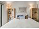 Neutral bedroom with built-in shelves and a decoratively pillowed bed at 663 Serramonte Dr, Marietta, GA 30068